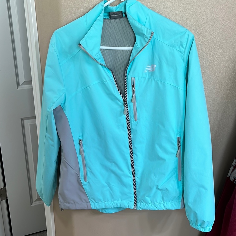 New Balance Women’s L windbreaker. Color is almost Tiffany Blue.